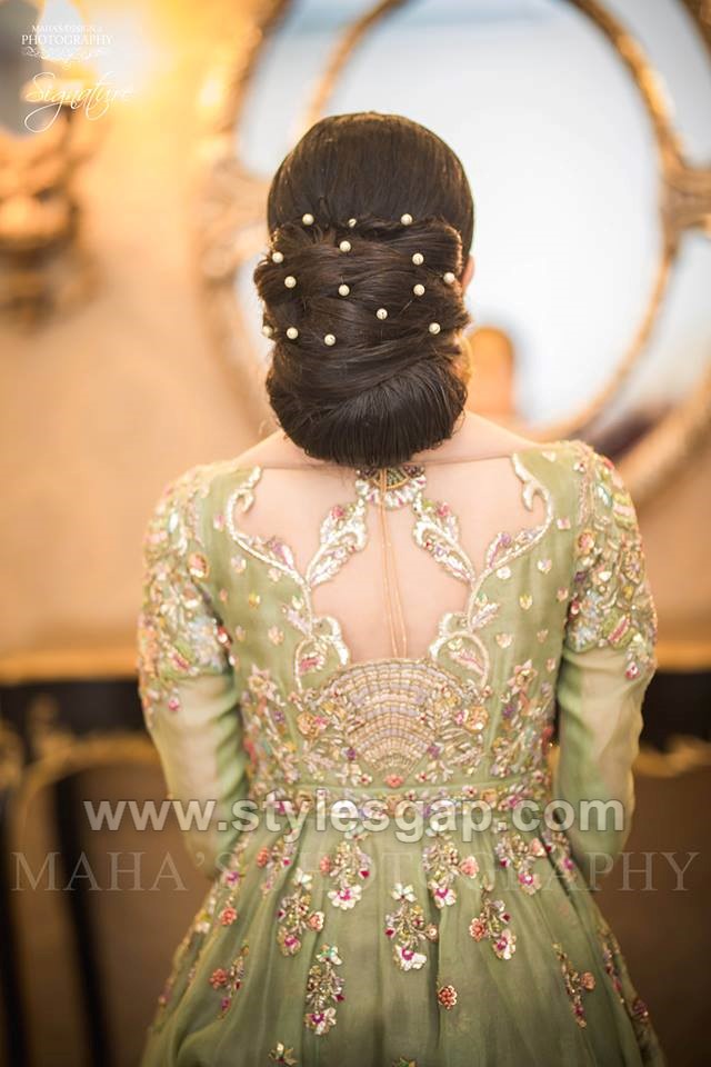 Image of Bun with side braid Pakistani bridal hairstyle