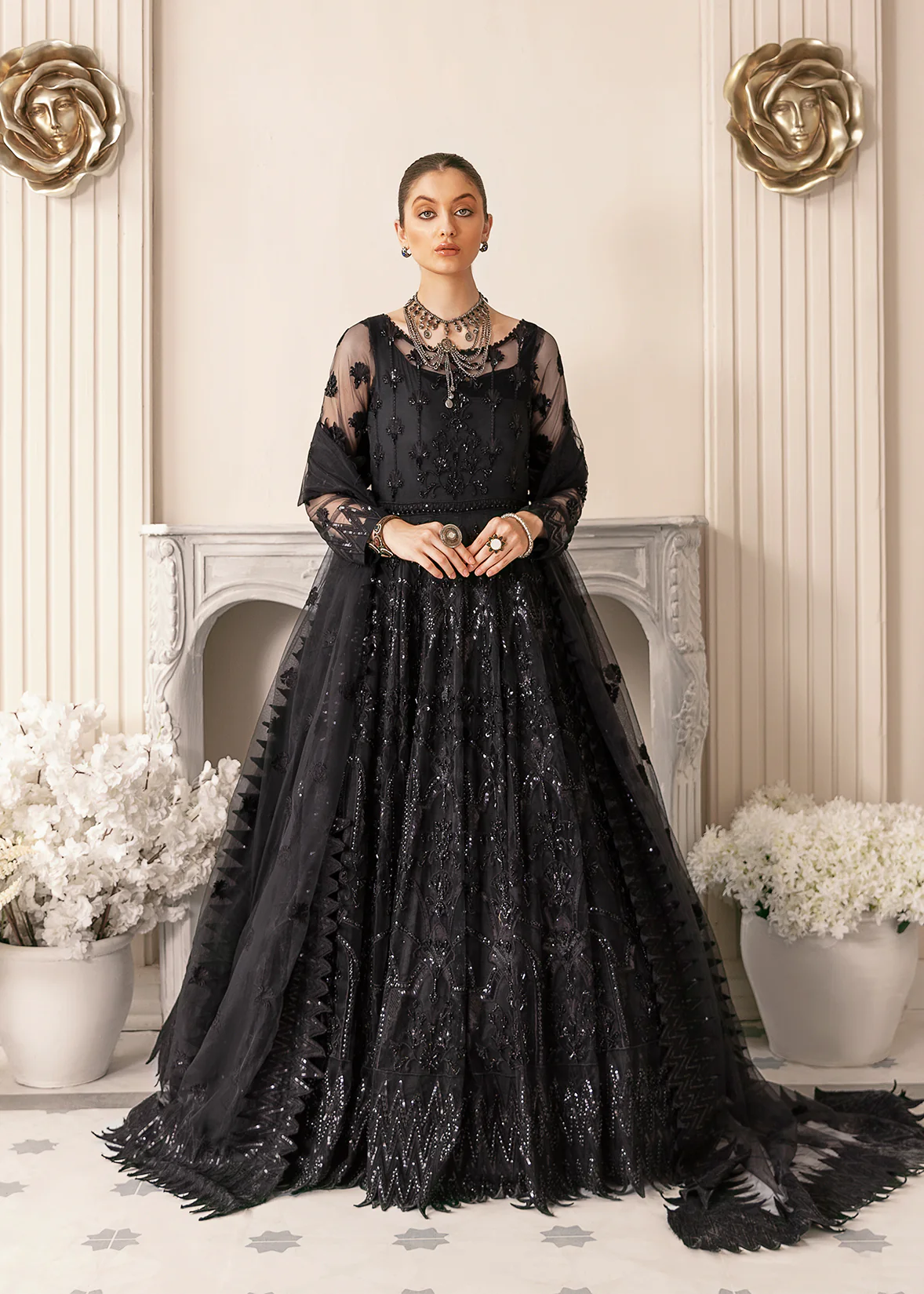 Need a fashionable gown design in plumand black colour without sleeves.
