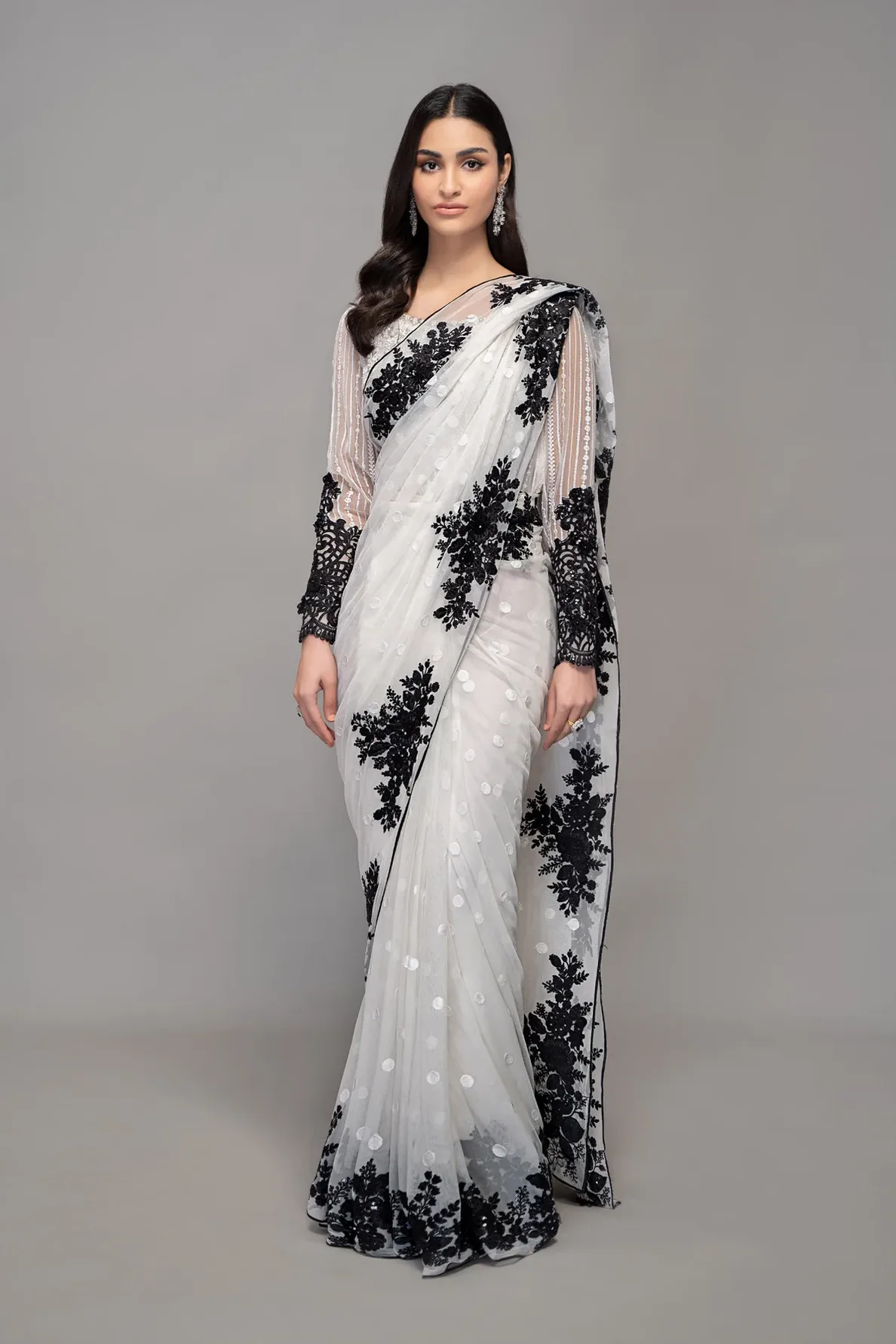 white soft net saree with black floral motifs
