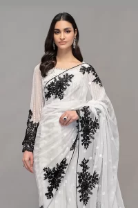 white net saree with black floral motifs